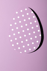Easter greeting card with pastel pink paper eggs with dots .Creative greeting concept. Layout with copy space for your text