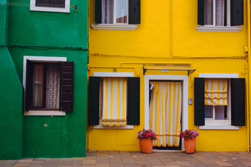 Fototapeta na wymiar Beautiful Venice landmark, Burano island canal, colorful houses and boats, Italy