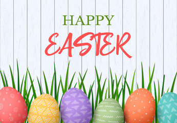 Happy Easter. Easter colorful eggs in row with different simple ornaments. white wooden background