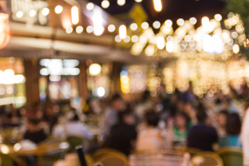 abstract blur image of night festival in a restaurant and The atmosphere is happy and relaxing with...