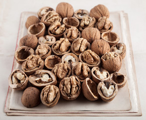 Beautifully presented walnuts on old book pages can be used as background