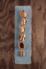 Beautifully presented walnuts on rusty wood table can be used as background