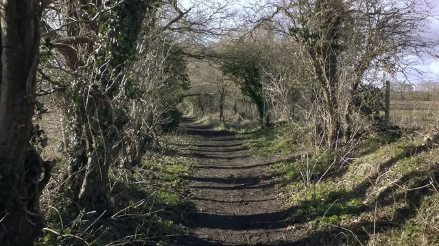Part 4 of 4, Ride through empty countryside walking track. Wet ground with mud and puddles.  Baker Path, Tarvin, Cheshire, England