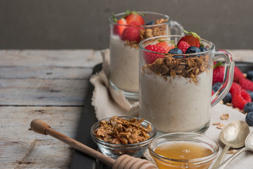 Breakfast parfait with homemade granola, fresh fruits and yogurt