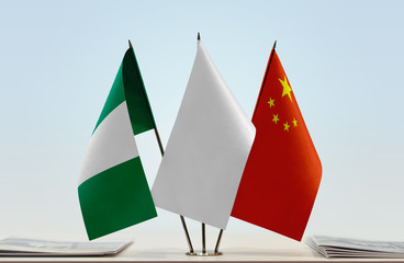 Flags of Nigeria and China with a white flag in the middle