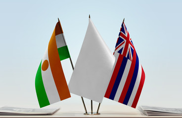 Flags of Niger and Hawaii with a white flag in the middle