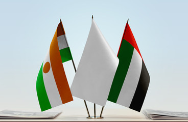 Flags of Niger and UAE with a white flag in the middle