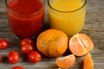 Two glass of fresh tomato juice and orange juice 