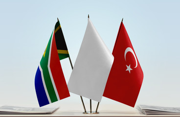 Flags of Republic of South Africa and Turkey with a white flag in the middle