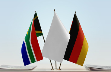 Flags of Republic of South Africa and Germany with a white flag in the middle