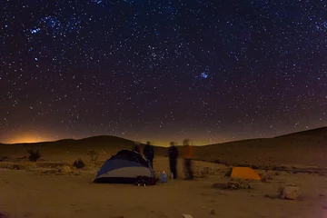 Rolgordijnen Night camping tents people talk, night stars sky. © subbotsky