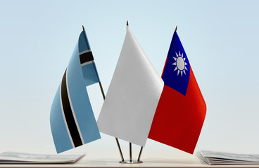 Flags of Botswana and Taiwan with a white flag in the middle