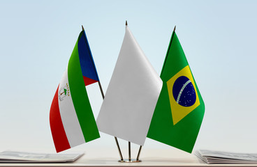 Flags of Equatorial Guinea and Brazil with a white flag in the middle