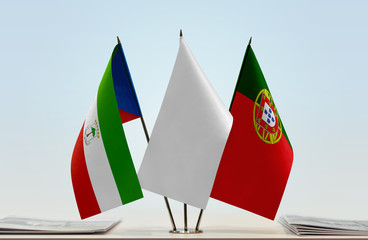 Flags of Equatorial Guinea and Portugal with a white flag in the middle