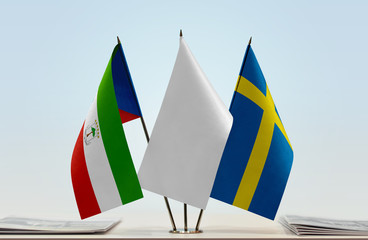 Flags of Equatorial Guinea and Sweden with a white flag in the middle