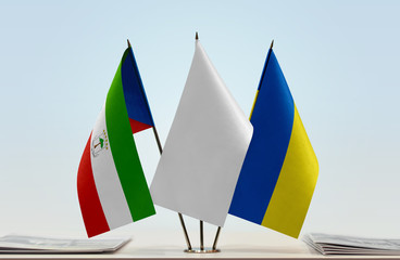 Flags of Equatorial Guinea and Ukraine with a white flag in the middle