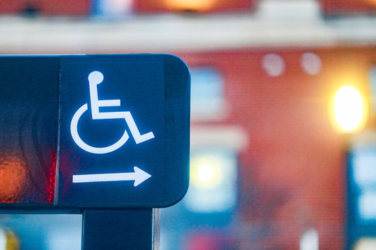 Wheelchair sign pointing right