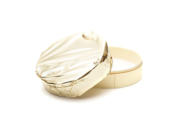 Beautiful Round of Soft Cheese with Gold Foil Wrapper © pamela_d_mcadams