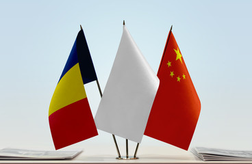 Flags of Chad and China with a white flag in the middle