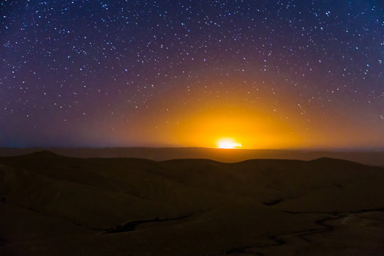 Night Sky Stars Over Desert Hills Sunset Light.