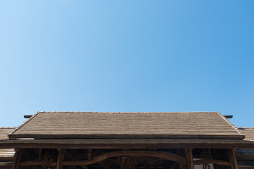 Vintage tile roof with blue sky