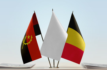 Flags of Angola and Belgium with a white flag in the middle