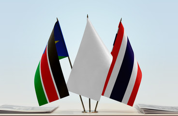 Flags of South Sudan and Thailand with a white flag in the middle