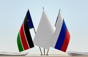 Flags of South Sudan and Russia with a white flag in the middle