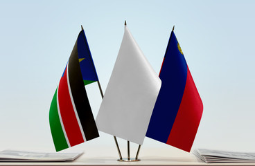 Flags of South Sudan and Liechtenstein with a white flag in the middle