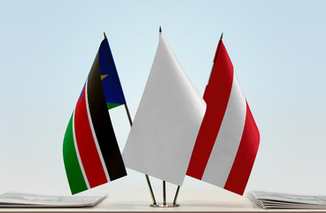 Flags of South Sudan and Austria with a white flag in the middle