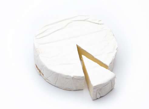 Beautiful White Round of Soft Cheese Isolated on a White Background