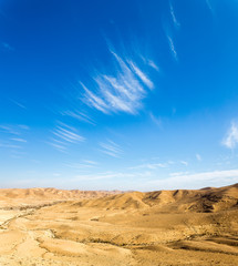 Fototapeta na wymiar Desert hill clouds shapes, south Israel landscape.