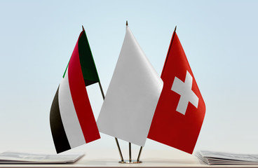 Flags of Sudan and Switzerland with a white flag in the middle