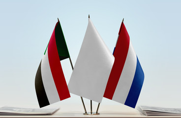 Flags of Sudan and Netherlands with a white flag in the middle