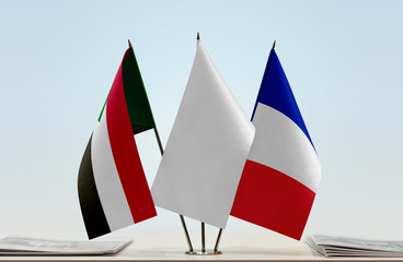 Flags of Sudan and France with a white flag in the middle