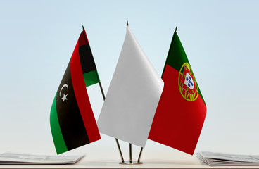 Flags of Libya and Portugal with a white flag in the middle