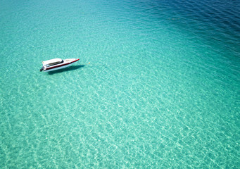 boat on the clear water in sea