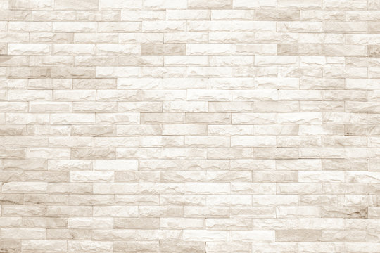 Cream and white brick wall texture background or wallpaper abstract paint to flooring and homework.