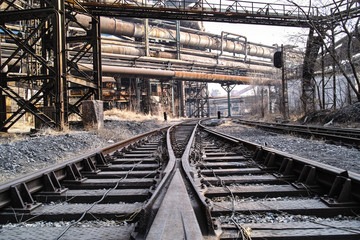 Rusted railway and abandoned steelmaking equipments © axz65