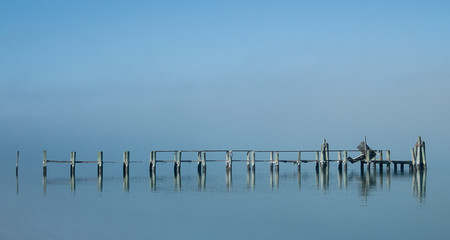 Abandoned Pier On A Foggy Morning