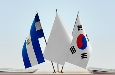 Flags of El Salvador and South Korea with a white flag in the middle