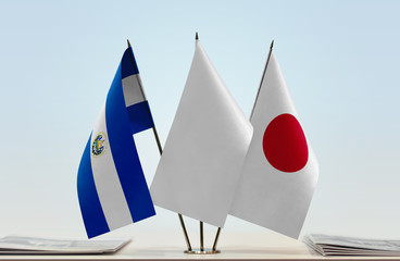 Flags of El Salvador and Japan with a white flag in the middle