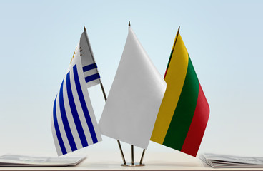 Flags of Uruguay and Lithuania with a white flag in the middle