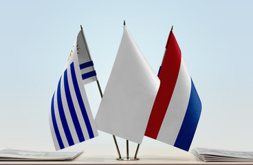 Flags of Uruguay and Netherlands with a white flag in the middle