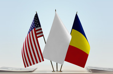 Flags of USA and Chad with a white flag in the middle
