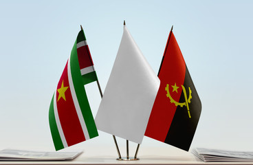 Flags of Suriname and Angola with a white flag in the middle