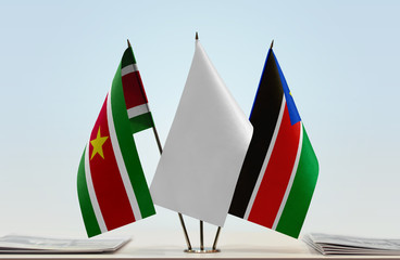 Flags of Suriname and South Sudan with a white flag in the middle