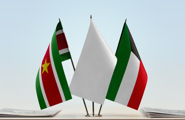Flags of Suriname and Kuwait with a white flag in the middle