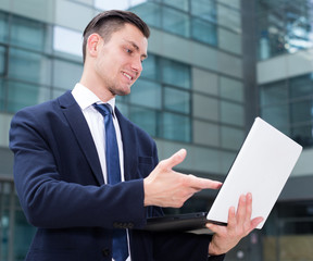 Financial director is examining project on a laptop