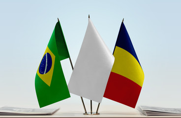 Flags of Brazil and Chad with a white flag in the middle